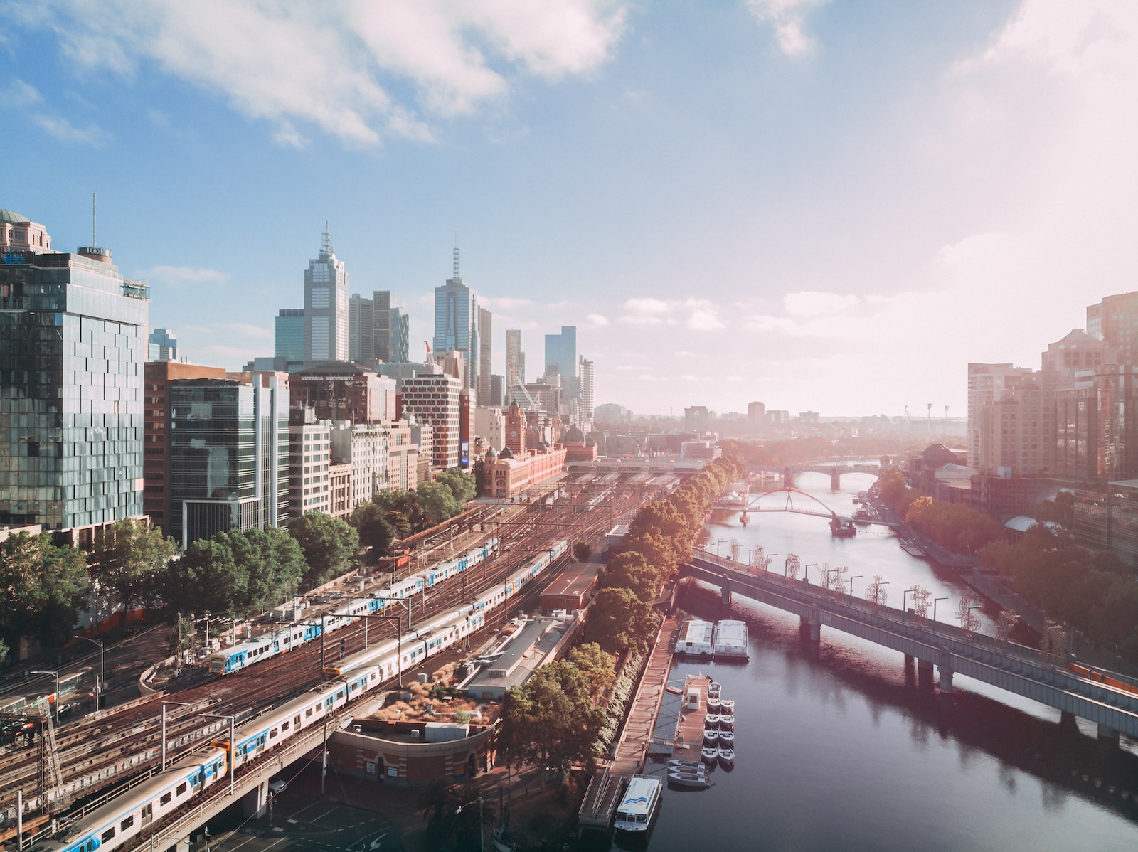 Photo by Dmitry Osipenko city buildings near body of water during daytime